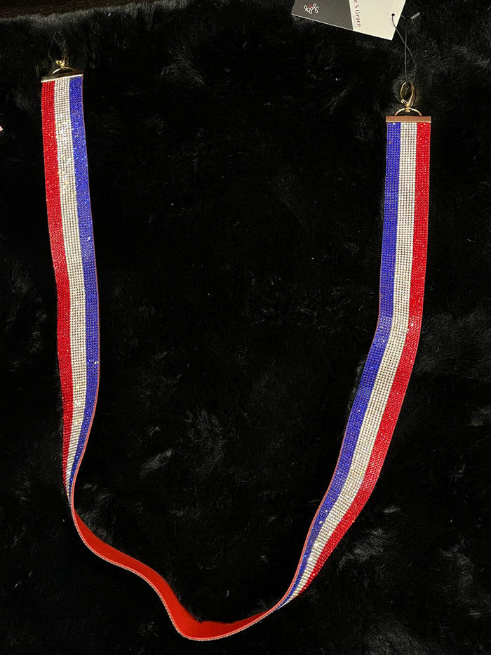 red, white, and blue water bottle strap